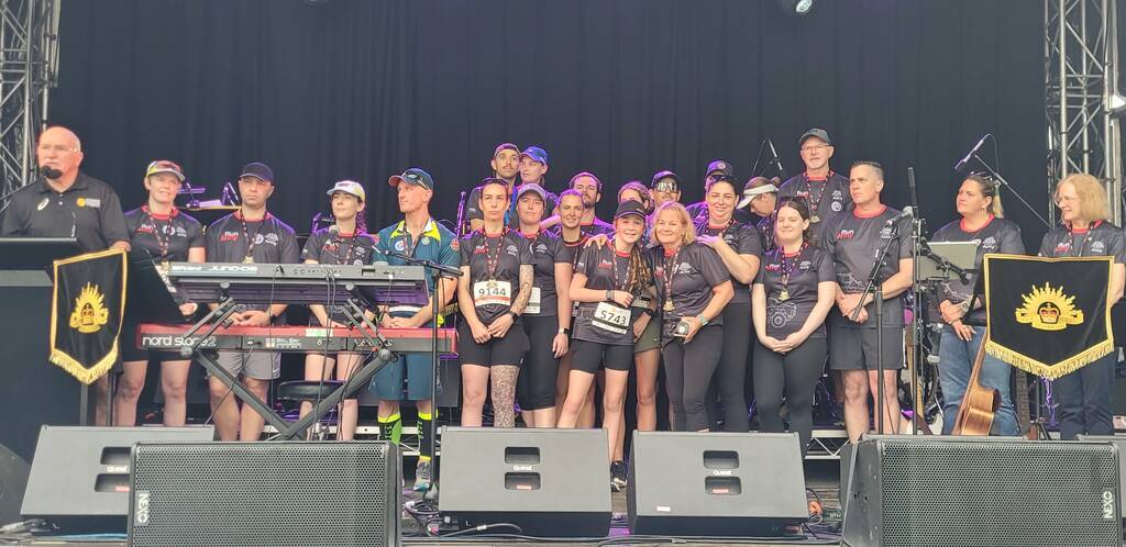 Metro North Run Club receives its Best Fundraiser trophy,